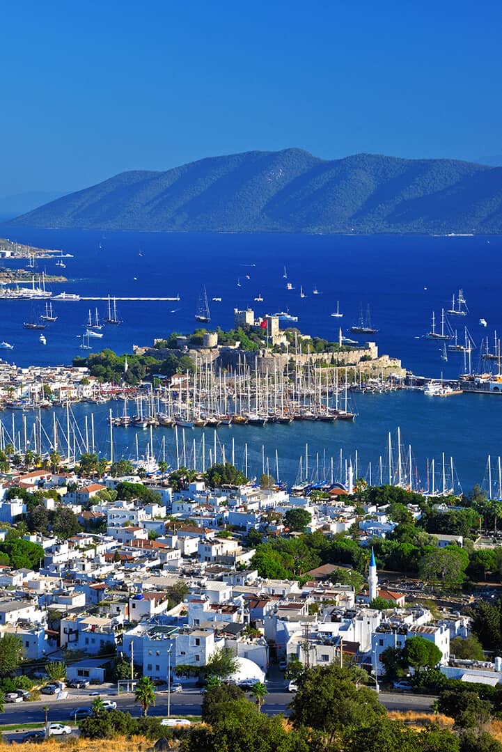 Bodrum Castle and harbor, whitewashed town and yachts below the Aegean mountains