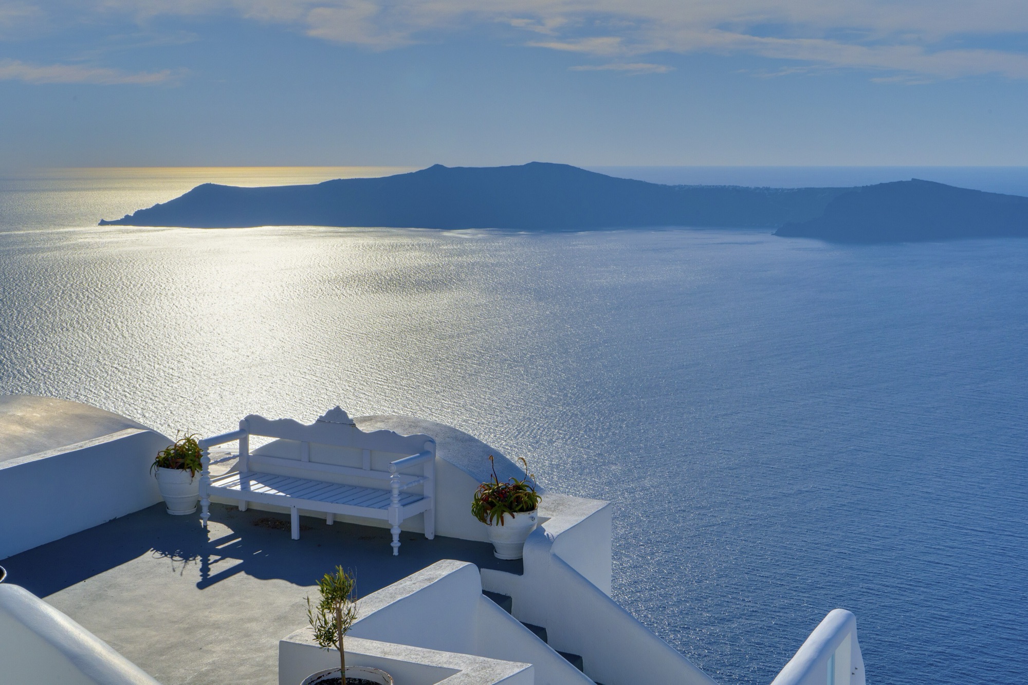 A private whitewashed terrace overlooking the caldera in Oia, Santorini