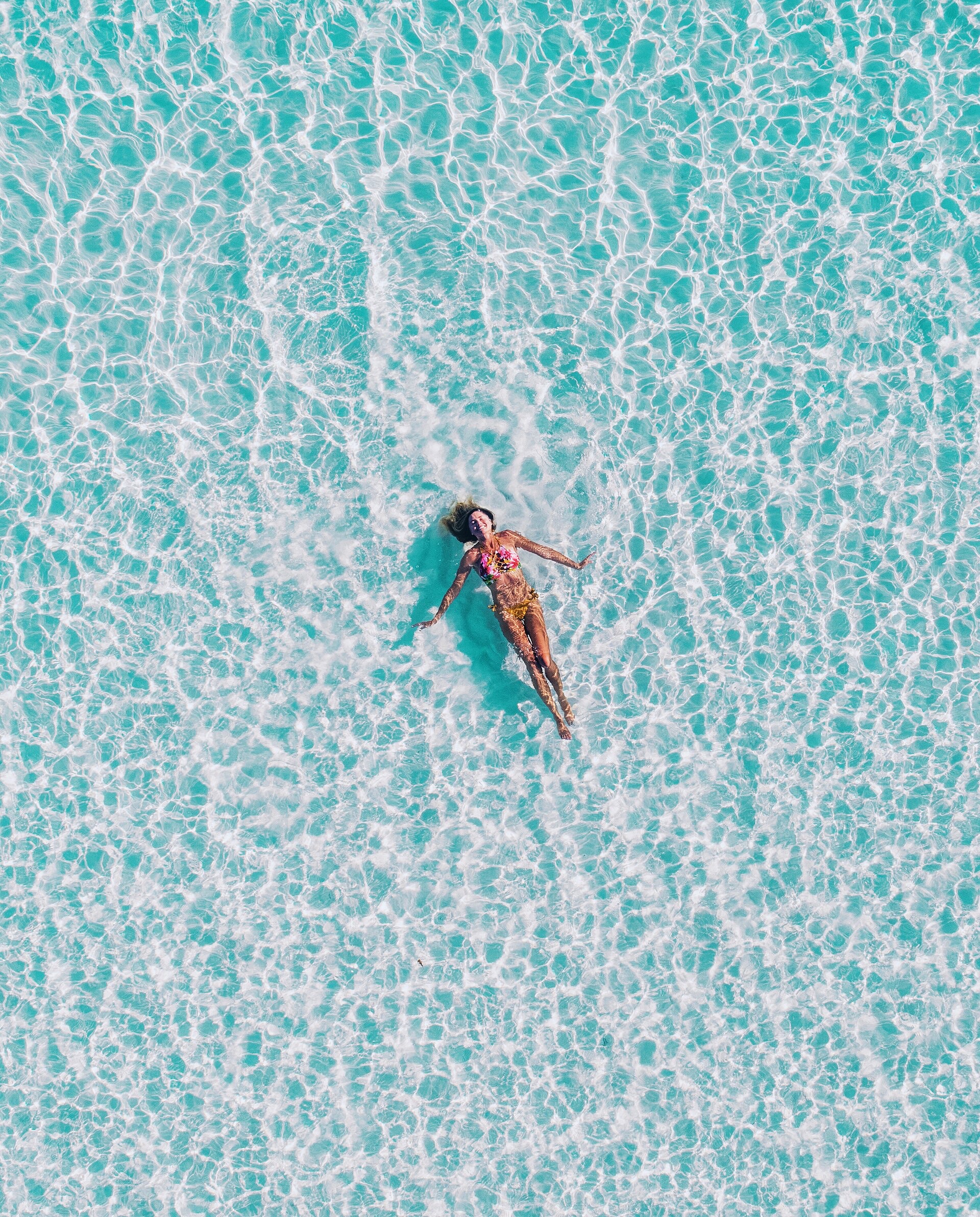 Aerial view of crystal-clear turquoise water